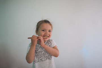 Cute little girl brushing his teeth. Oral hygiene.