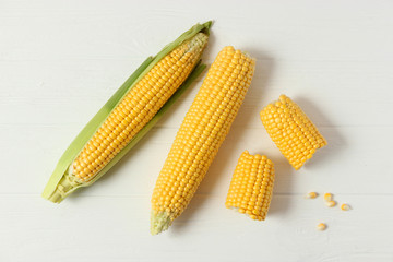 Fresh corn on a light background. Corn heads.