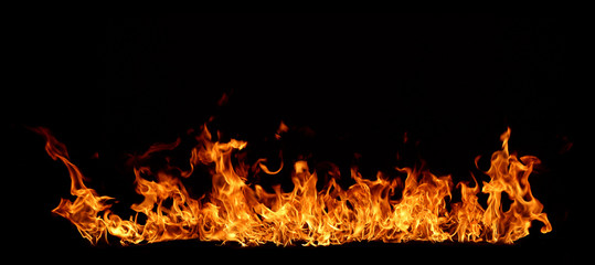 A red flame that is burning on a black background.