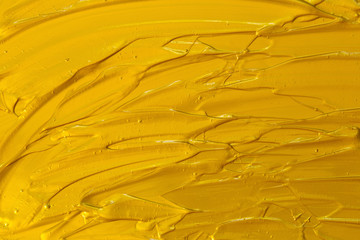 Golden acrylic texture, wave, abstract background.
