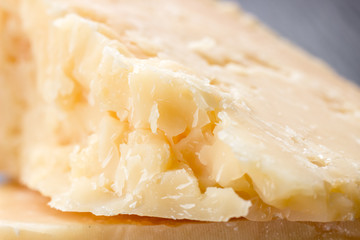 Cheese texture, closeup. Hard seasoned cheese structure in macro shot