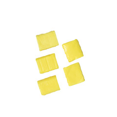 five yellow rectangular chewy candy isolated on a white background