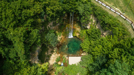 Fototapeta na wymiar Waterfall in the forest. National park, wonder. Top-down aerial drone shot 03