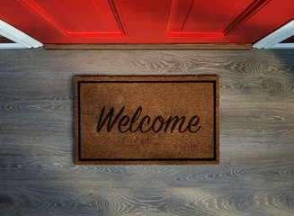 Foto op Plexiglas Overhead view of welcome mat outside inviting front door of house © Mstock