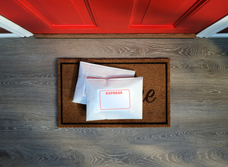 Express service envelopes delivered to door step. Overhead view. Copy space