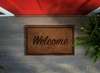 Foto op Plexiglas Overhead view of welcome mat outside inviting front door of house © Mstock
