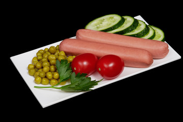 Snack with sausages, cucumber, tomatos and canned peas on black background, isolated