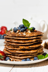 stack of homemade pancakes for breakfast, vertical closeup