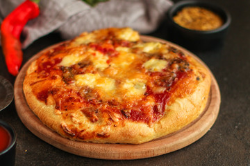pizza with different types of cheese (tomato sauce and other ingredients, snack). top food background. copy space