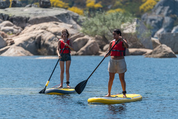 Naklejka premium Stand up paddle on a lake