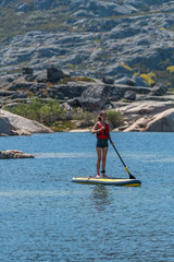 Naklejka premium Stand up paddle on a lake