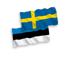 National vector fabric wave flags of Estonia and Sweden isolated on white background. 1 to 2 proportion.
