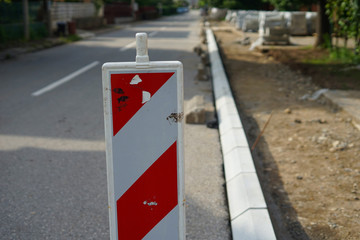 Warning signs for carrying out works on the street. Reconstruction of sidewalk