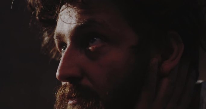 Depressed drug addict staring away