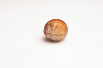 Hazelnut heap on wooden table, selective focus