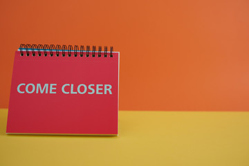  Colorful background with a notebook on top of a table and a notebook. Contemporary and youth design.