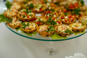 small sandwiches on the buffet table