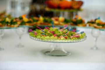 small sandwiches on the buffet table