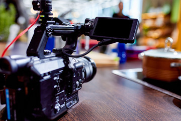 Behind the scenes of video production or video shooting. The concept of production of video content for TV, blog, shows, movies. Cameras prepared for video filming