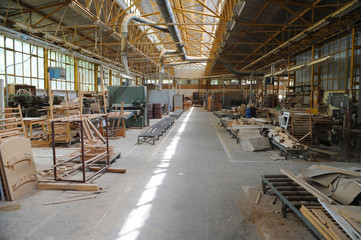 Wood processing machines and pieces of products in a furniture factory