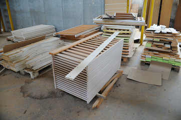 Wood processing machines and pieces of products in a furniture factory