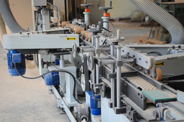 Wood processing machines and pieces of products in a furniture factory