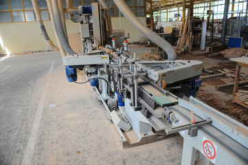 Wood processing machines and pieces of products in a furniture factory