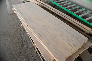 Wood processing machines and pieces of products in a furniture factory