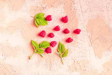 fresh raw raspberries with green leaves, healthy diet lifestyle concept