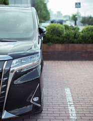 the car is parked near the building on the site of the red brick road