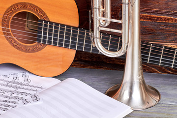 Guitar, trumpet and musical notes. Set of musical instruments. Classical musical equipment.