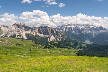 Idyllic Alps with green mountain hill under sky