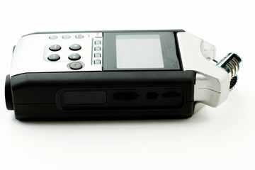 Handy recorder isolated on white background. Grey digital dictaphone, side view. Voice recording device.