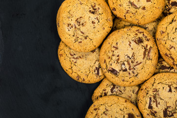 Chocolate Chip Cookies on Black Background. Selective focus.