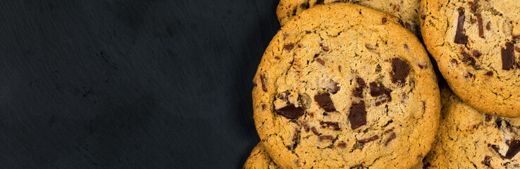 Chocolate Chip Cookies on Black Background. Selective focus.