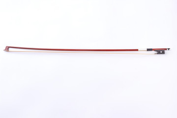 Fiddle stick isolated on white background. Studio shot of violin bow. Vintage classical violin fiddle stick.