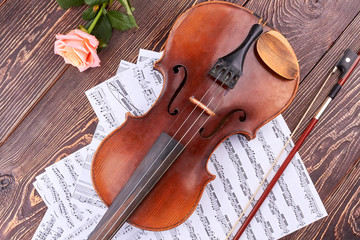 Violin, bow, music notes and rose. Classical music instrument and flower. Romantic musical...