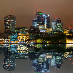 Naklejka premium London skyline with its famous skyscrapers at night