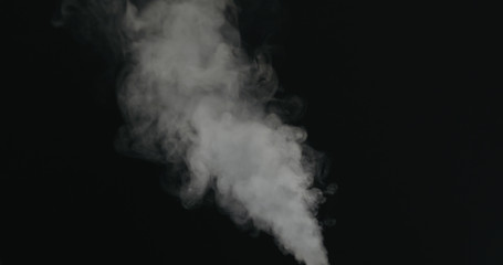 water vapor stream comes from below over black background with motion blur