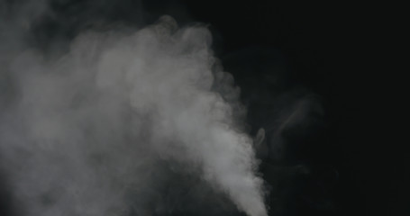 water vapor stream comes from below over black background with motion blur