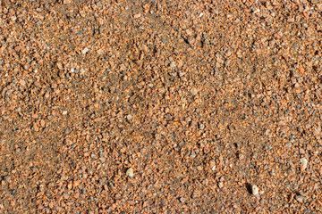 Soft covering of a walking trail gravel crushed stone crumb texture