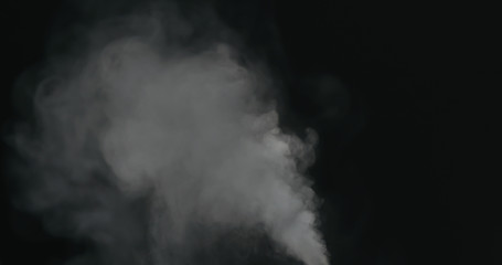 water vapor stream comes from below over black background with motion blur