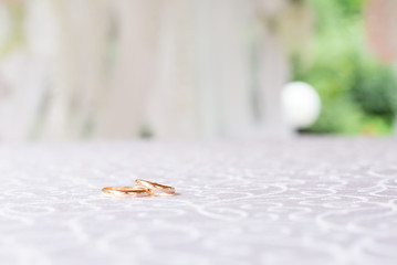Wedding gold rings on a beautiful background. wedding ceremony gathering bride and groom. two mr and mrs