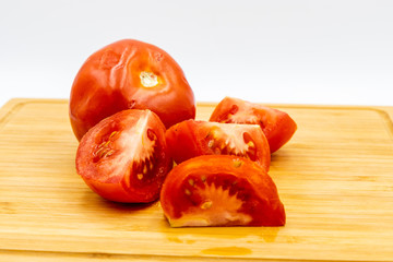 Red tomatoes on a wooden cutting board. Calgary, Alberta, Canada