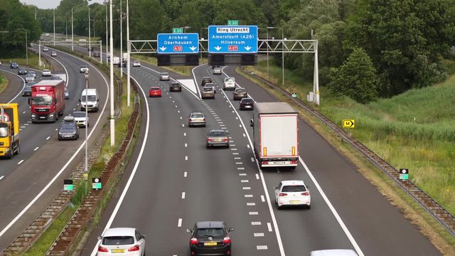 commuters on Highway at crossing A12 and A27 at Utrecht during the evening rush, Utrecht, The Netherlands, July 12th 2019