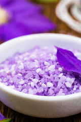 Obraz na płótnie Canvas Purple Lilac and Clematis Salt for Spa and Aromatherapy. Selective focus.