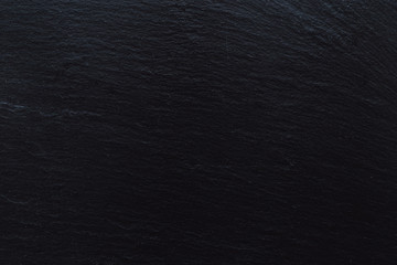 Textured dark ardesia stone background – Black slate board with veins for serving food – Modern...