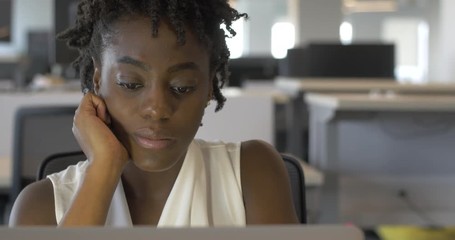 Bored Young Black Woman at Job