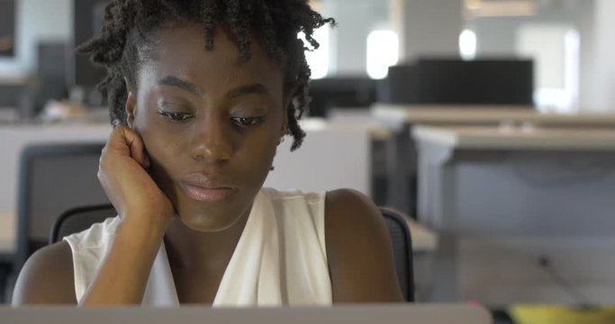 Bored Young Black Woman at Job