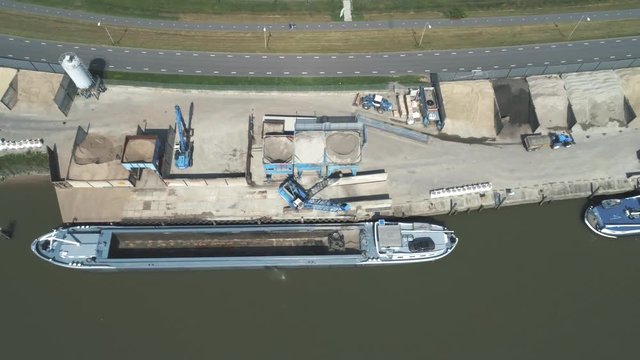 Aerial view of the processing plant with the sand fractionator at the edge of a quartz sand quarry pond for white quartz sand, made with drone
